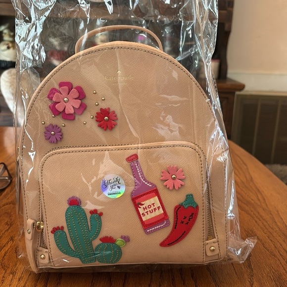 Kate Spade New York Novelty Cactus Tommi Cashew Hot
Stuff Backpack $329